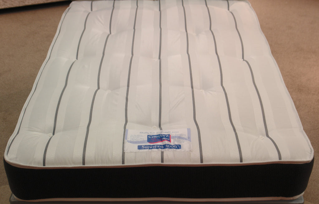 This top view of the Superfirm 3000 Spring Mattress shows the high durability grey & white stripe, tufted damask fabric. The border is Dark Grey Herringbone fabric. Both sides are extra firm with a 12.5 gauge rod edged Bonnell spring unit, super compressed fillings & heavy duty double insulated pad.