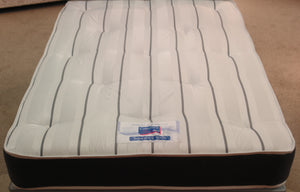 This top view of the Superfirm 3000 Spring Mattress shows the high durability grey & white stripe, tufted damask fabric. The border is Dark Grey Herringbone fabric. Both sides are extra firm with a 12.5 gauge rod edged Bonnell spring unit, super compressed fillings & heavy duty double insulated pad.