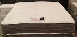 This Milan 1500 Pocket Memory Mattress top view shows the heavy duty stretch knit fabric top which has tufts. It features 2" Memory foam which is turnable. The dual season reverse side is medium tension as standard. 