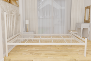 The Holly Wrought Iron Bed Frame, pictured here in ivory with a low foot end style.  It has decorative features to the head end and a very strong steel mesh base backed by a 5 year guarantee