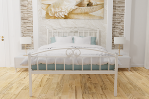 The Holly Wrought Iron Bed Frame, pictured here in ivory with a high foot end style.  It has decorative features to the head and foot ends, together with a very strong steel mesh base backed by a 5 year guarantee