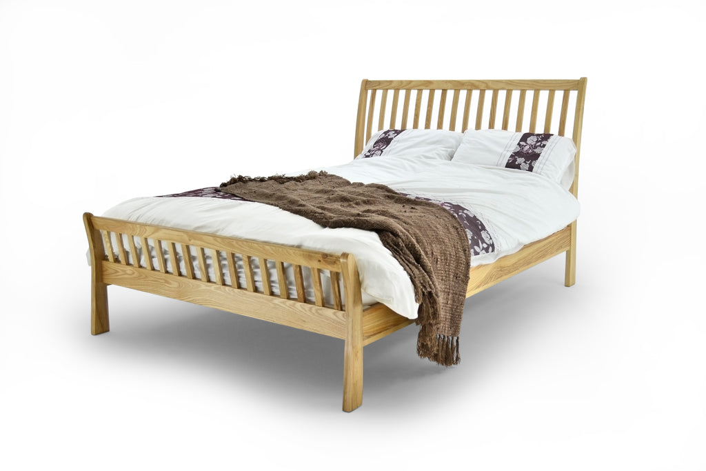 Solid Oak frame in double or king sizes. Slight sleigh style curve to head and foot ends. 4 cross bars, steel support system and beech sprung slats