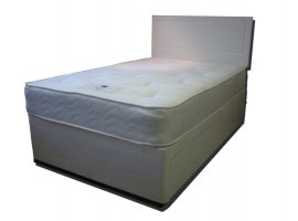 The Buckingham Open Coil Divan features: Medium tension; 12.5g spring unit with steel rod-edge; Generous poly-cotton fillings; Stress-free cloth; Tufted; Reversible; Matching fabric base