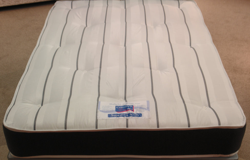 This top view of the Superfirm 3000 Spring Mattress shows the high durability grey & white stripe, tufted damask fabric. The border is Dark Grey Herringbone fabric. Both sides are extra firm with a 12.5 gauge rod edged Bonnell spring unit, super compressed fillings & heavy duty double insulated pad. 