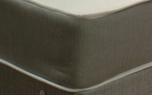 This corner view shows the Rhapsody mattress standard light grey damask border fabric