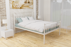 The Yiewsley Wrought Iron Bed Frame, pictured here in ivory with a high foot end style.  It has decorative features to the head and foot ends, together with a very strong steel mesh base backed by a 5 year guarantee